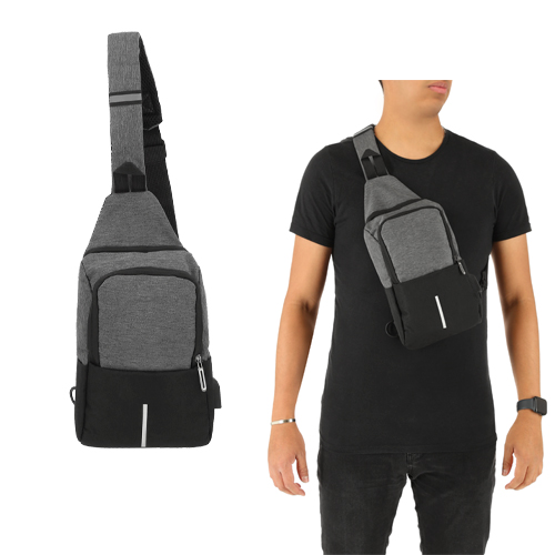 Bolsa de hombro con 1 compartimento de seguridad y 1 frontal. Incluye franja antirreflejante en la parte frontal y asa superior. GRIS